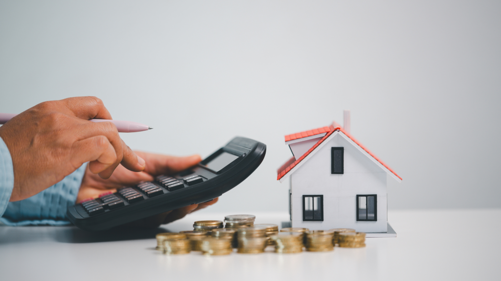 A man calculating his home loan rates on a calculator